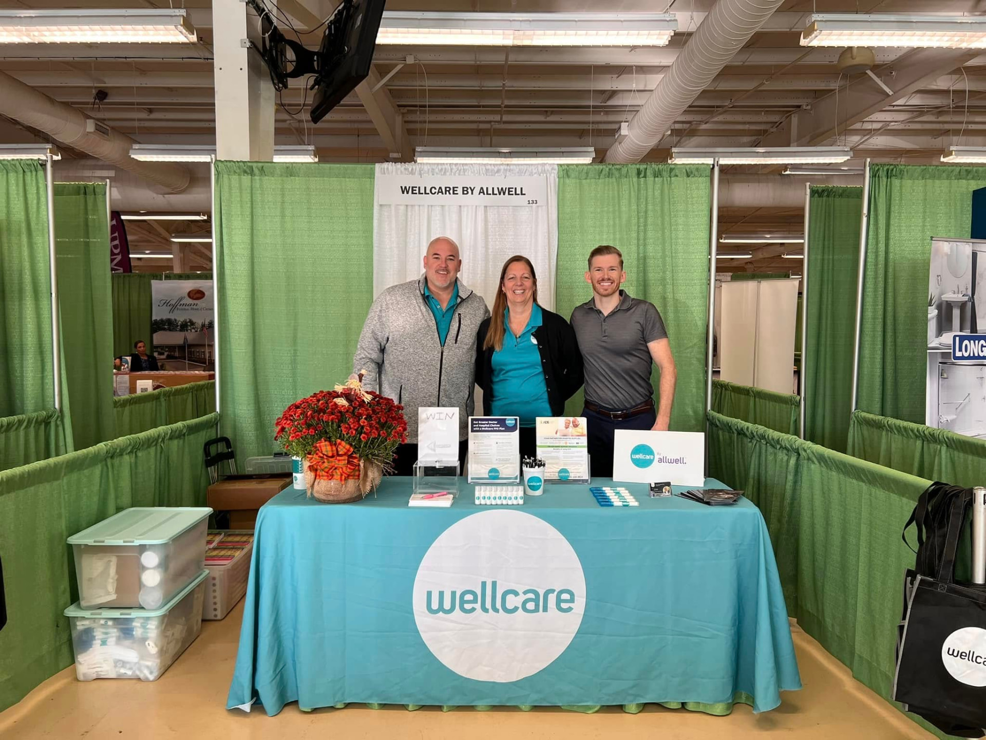Nu Life agents at a Wellcare by Allwell exhibit booth