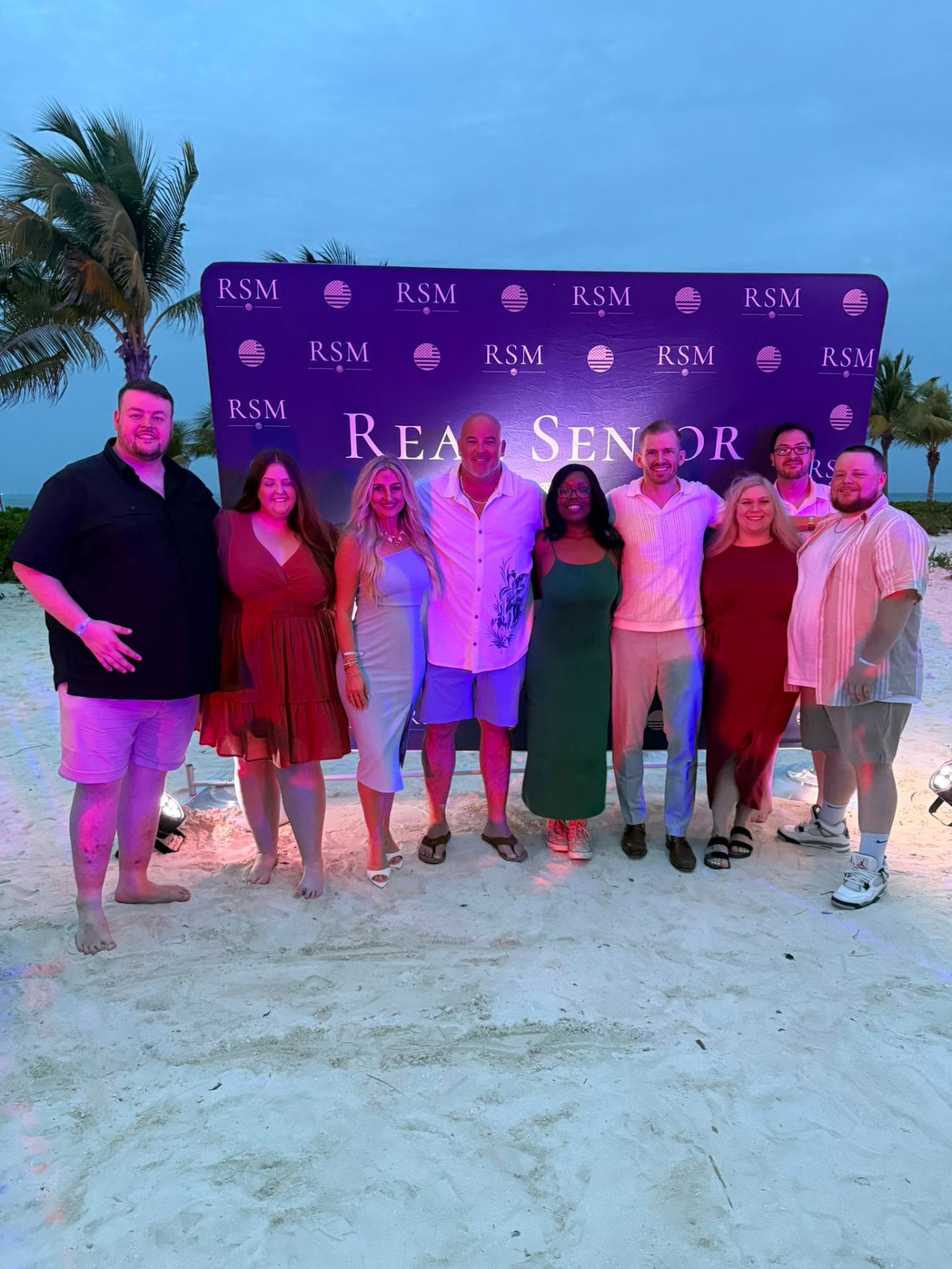 The Nu Life Healthcare team at an industry recognition event on the beach
